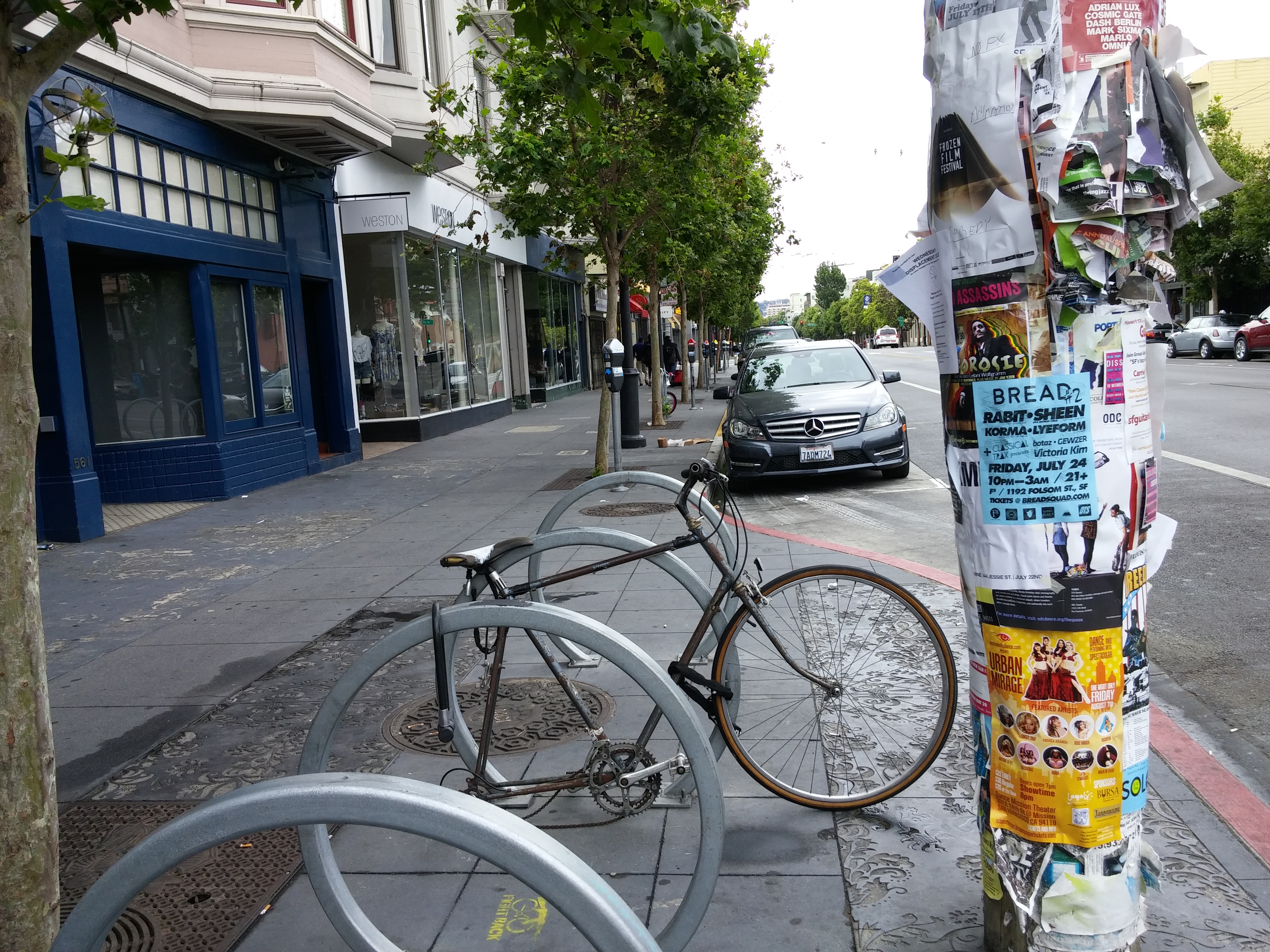 Street photo of a BREAD #2 poster on a San Francisco utility pole